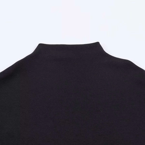 Close-up of mock neck collar stitching on this minimalist black summer dress for women