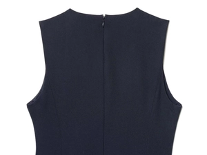 Detail of navy blue sleeveless dress featuring back invisible zipper and twill fabric texture