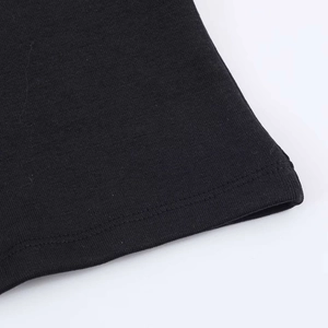 Detail of double-stitched hem on a black minimalist mock neck mini dress fabric