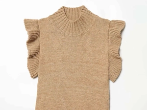 Detail of light brown knit top featuring high neck and ruffle sleeve textures