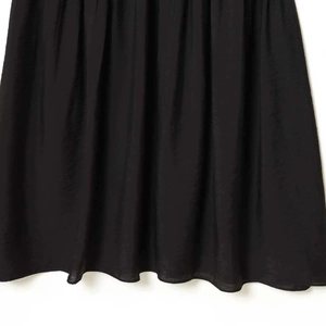 Elegant black pleated waist dress in lightweight fabric with high-quality hem detail