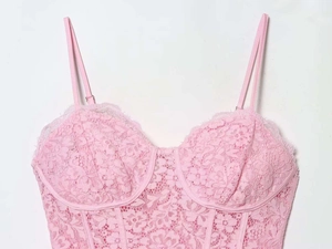 Close-up of pink floral lace bustier top with eyelash lace trim and underwire cups