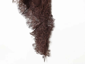 Detailed view of dark brown eyelash lace fabric with intricate floral embroidery patterns
