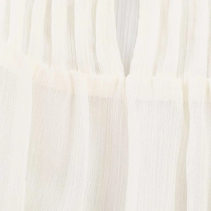 Detail of white semi-transparent pleated chiffon fabric showing soft vertical textures