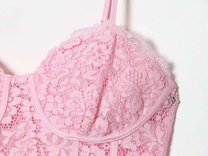 Detail of light pink floral lace camisole with underwired cups and eyelash lace edges