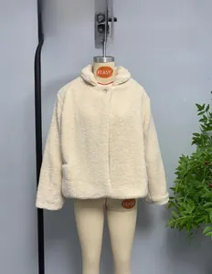 Close-up of cream teddy faux fur texture and lapel collar on this stylish short jacket