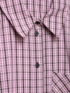 Detail of pink and brown plaid cotton shirt showing pointed collar and resin buttons