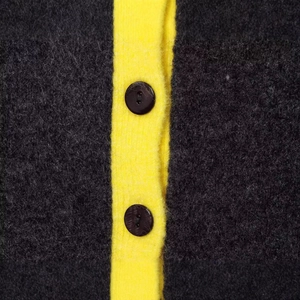 Knit cardigan with yellow contrast trim and high-quality wool texture with black buttons