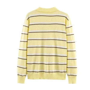 Detail of vintage striped knit sweater showing polo collar and yellow ribbed cuffs texture