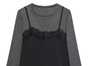 Close-up of gray knit top with black lace trim overlay and detailed layered stitching