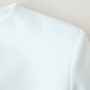 Elegant white stand collar dress with button detail and structured shoulder seams