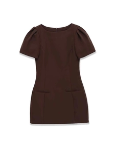 Detail of a brown puff sleeve mini dress with a straight neckline and decorative front pockets