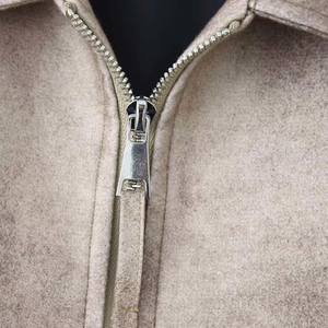 Fashionable tan suede jacket featuring a classic lapel and premium silver metal zipper