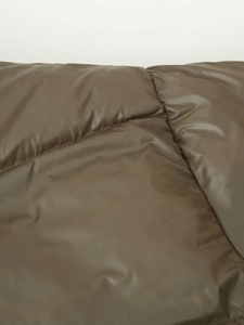 Close-up of olive green quilted puffer jacket fabric with a subtle glossy finish