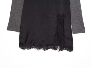 Detailed view of the delicate black eyelash lace trim on a gothic velvet midi dress