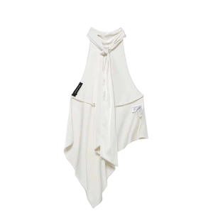 Detail of a creamy white satin halter neck top with smooth silk-like texture and tie neck