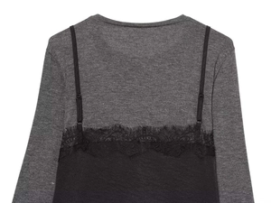 Detail of the delicate black eyelash lace trim on the layered knit dress top