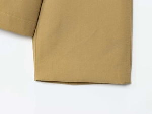 Detailed close-up of the khaki jacket cuff featuring high-quality double-stitched seams