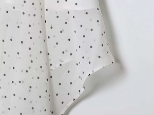 Detailed view of polka dot chiffon fabric with high-quality hem stitching for women skirt