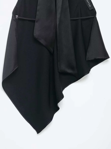 Detail of black satin fabric with JEFEIR brand label and silver metal T-buckle accent