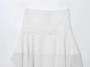 Close-up of high-waist white polka dot chiffon skirt with hidden side zipper detail
