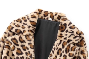 Close-up of leopard print faux fur coat featuring soft texture and smooth black lining