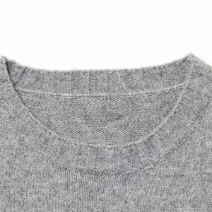 Minimalist grey slim-fit knit vest top with a round neck and premium ribbed texture