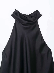 Detail of elegant black satin halter top featuring a graceful draped cowl neckline design