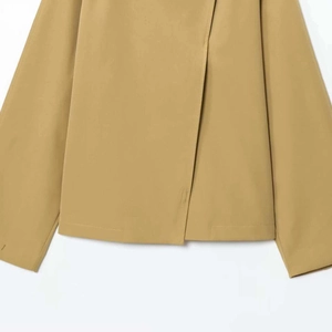 Minimalist khaki jacket with asymmetric overlap button closure and clean hemline