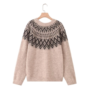 Classic Nordic knit sweater with geometric diamond patterns and ribbed cuffs on light beige fabric