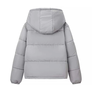 Rear view of a light grey quilted jacket with a fixed hood and windproof hem design