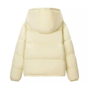 Detail of the horizontal quilting and detachable hood on this warm cream winter coat