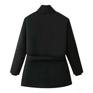 Detail view of the high neck and adjustable waist tie on this black padded winter coat
