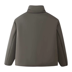 Macro detail of the quilted back texture and stand collar on this grey padded jacket
