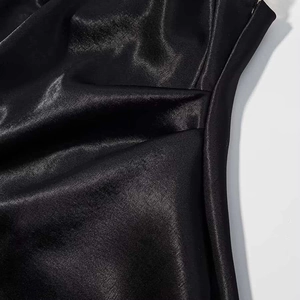 Close-up view of the premium black satin fabric texture and high-quality stitching details