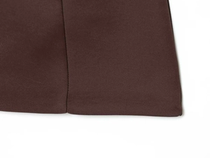 Detailed macro view of high-quality dark brown twill fabric with precise stitching details
