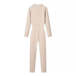 Slim fit beige ribbed knit jumpsuit with long sleeves and front half-zipper design