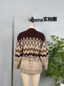 Detail of vintage geometric jacquard knit cardigan with premium earth-tone earth weave