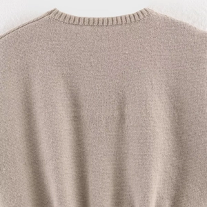 Women's chic loose sleeveless knit vest with detailed ribbed neckline in taupe color