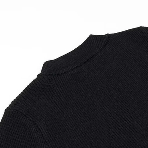 Detail shot of the back collar and vertical ribbed knit texture on the black jumper