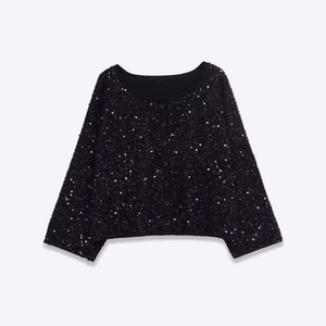 Giacca da donna con paillettes nere, girocollo e bottoni per look da festa