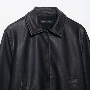 Classic black faux leather lapel jacket for women featuring a minimalist smooth texture