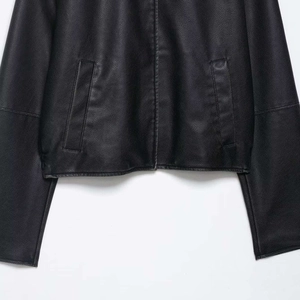Classic black faux leather jacket featuring a sleek front zipper and symmetric side pockets