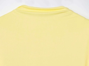 Detailed view of the fine knit texture and stitching on the back neckline of yellow dress