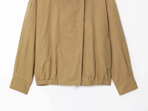 Detail of khaki pilot jacket showing elastic hem, side pockets and zipper closure