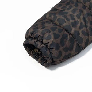 Detail shot of leopard print puffer jacket featuring elastic windproof ribbed cuffs