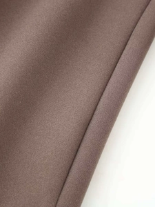 Close-up of brown wool fabric texture with refined stitching and soft fibrous surface