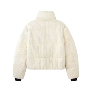 Back view of cream cable-knit quilted jacket with stand collar and black ribbed cuffs