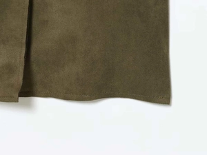 Detailed macro view of olive green faux suede trench coat fabric with fine stitching