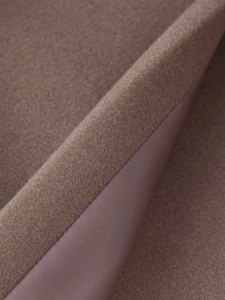 Detailed macro view showing the premium wool texture and silky inner lining of the coat